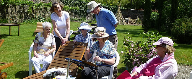 Sue with her group in the mill garden