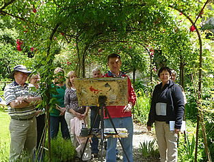 Terry and his painting group in the rose garden
