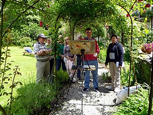 Terry Jarvis and his painting group in the rose garden at the watermill in Tuscany