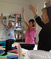 Enjoying a yoga class at the watermill in Tuscany