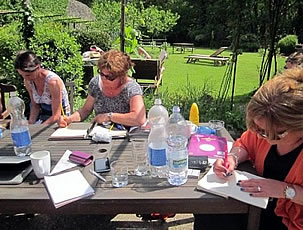 Writing outside at the watermill in Italy