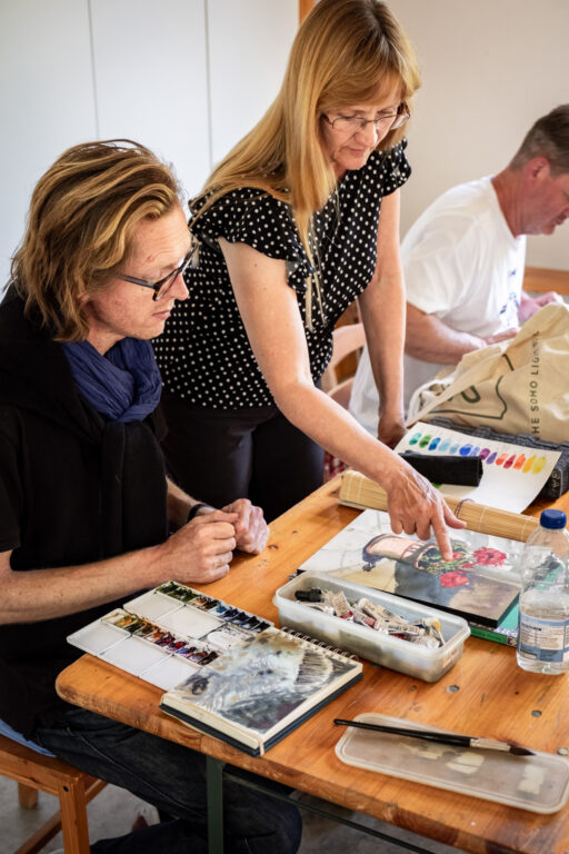 Artist and tutor Maggie Renner Hellman with a painting holiday guest at the studio in The Watermill at Posara.